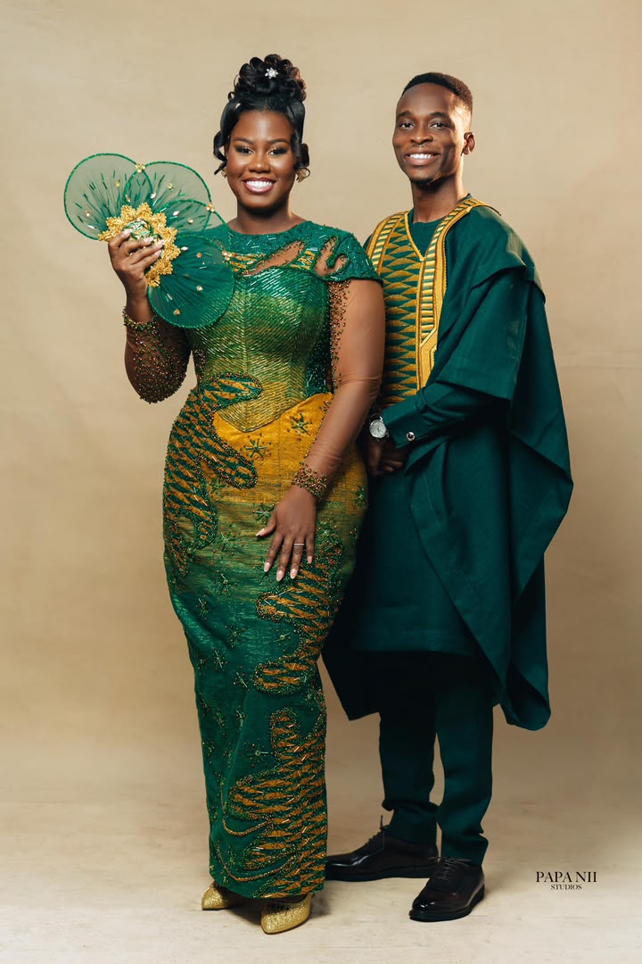 Ghanaian couple in traditional green and gold wedding attire